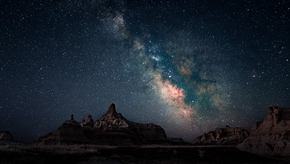 I don't know what the minimum distance a path needs to be to be considered a hiking trail but the Window Trail in Badlands National Park is 0.15 miles long one way.