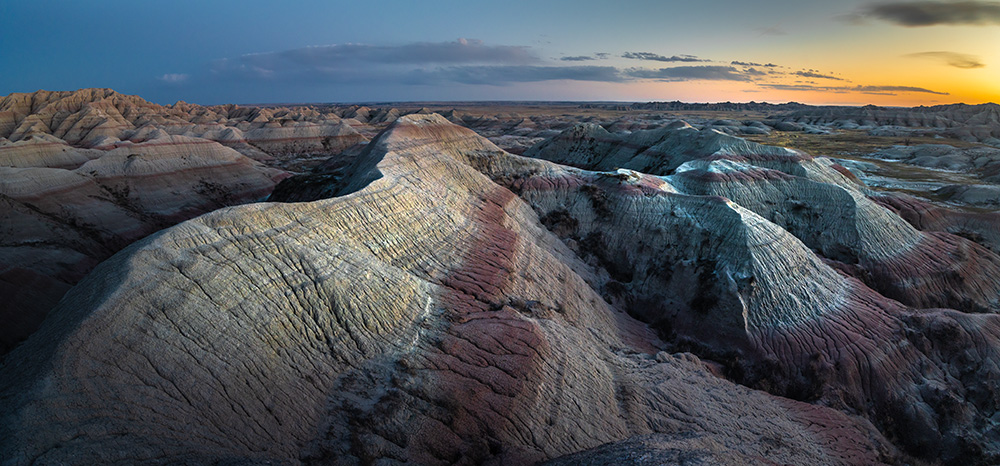 If there were to be a museum of mountains, it would be here in Badlands National Park. Rolling hills of the Carpathians, sharp razors of Patagonia, and the massive Himalayas—everything is represented here. Various shapes and colors, just reduced in size a few dozen times.