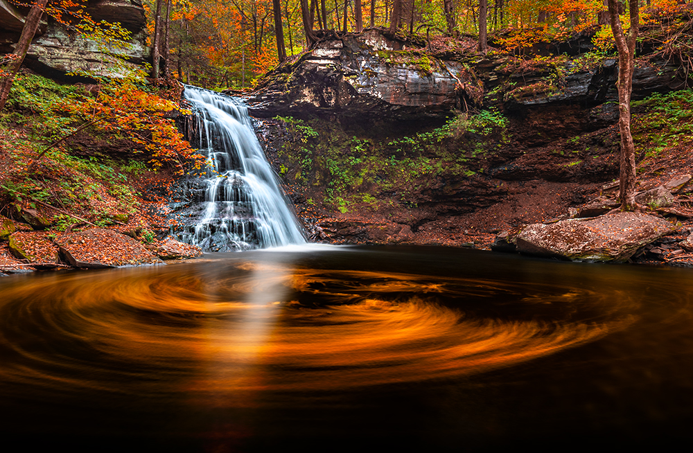 The next level in landscape photography, after waking up early and hiking far, would be carrying a couple of bags of fallen leaves to throw into a waterfall pool if there aren’t enough floating there for the composition.