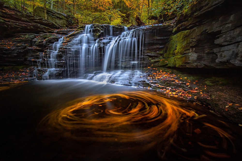 One of my favorite pictures taken in Ricketts Glen State Park. The peak of October foliage brings lots of colors and opportunities for artistic long-exposure photos.