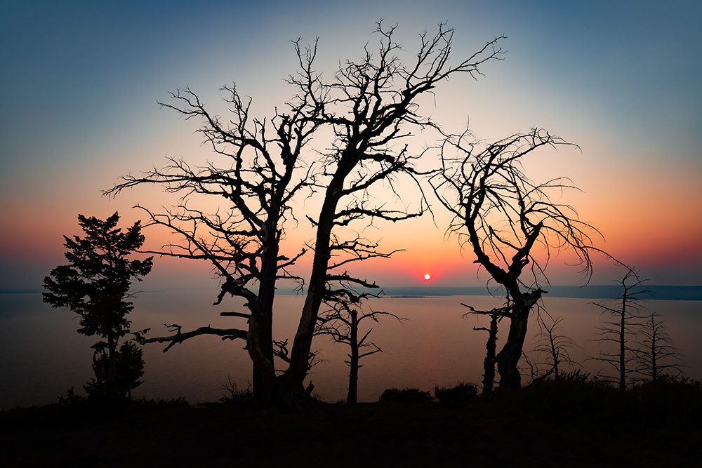 Sunset at Yellowstone Lake. Consistent smoke from the Western wildfires dominated the sky those days. Which in turn resulted in interesting light effects.