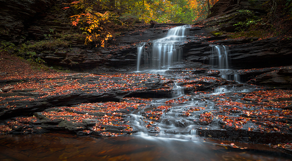 One of the most fascinating things I find about waterfalls is how drastically their appearance and mood change with varying amounts of water in the creeks and rivers. While a regular passerby might have been disappointed by the low water in the creek that October in Ricketts Glen, some waterfalls simply became even more photogenic.