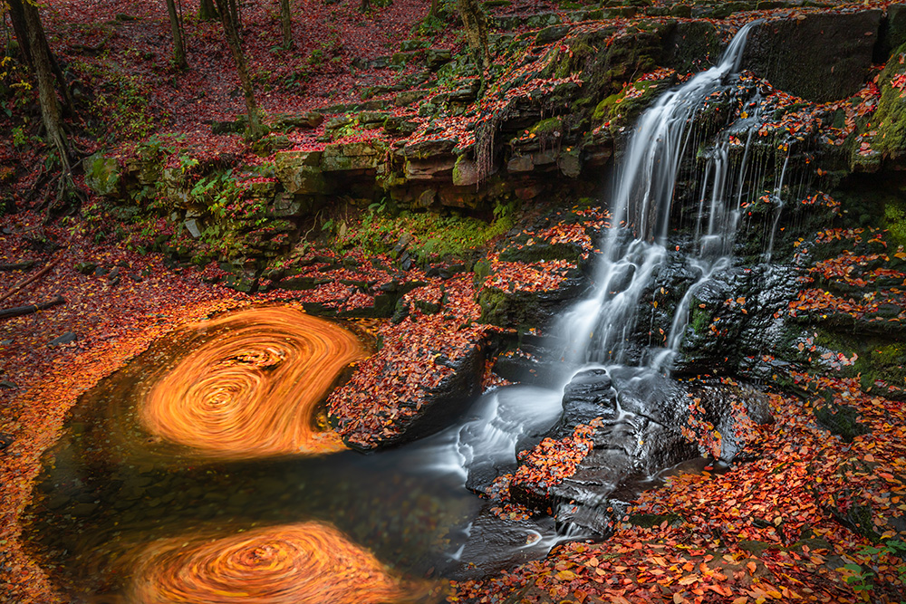 After an exhausting 100-foot-long hike from the parking lot, I relaxed by scrambling on the steep slope, searching for the most intriguing perspective of this roadside waterfall.